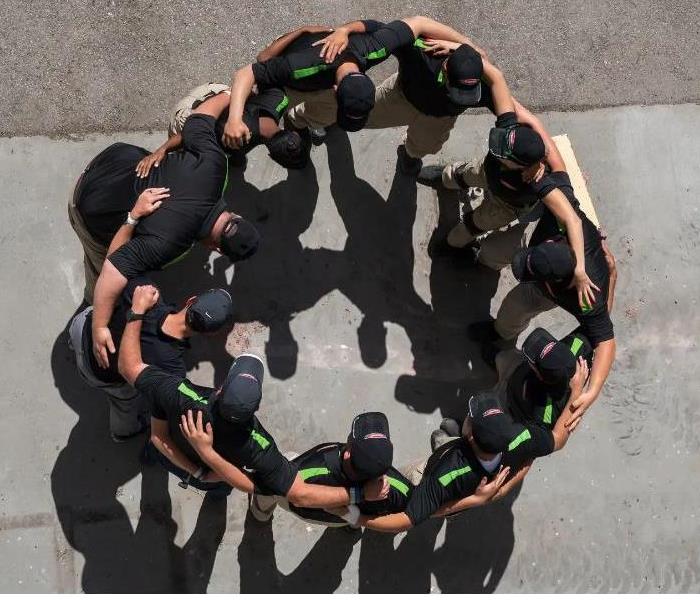 SERVPRO team gathered in a circle