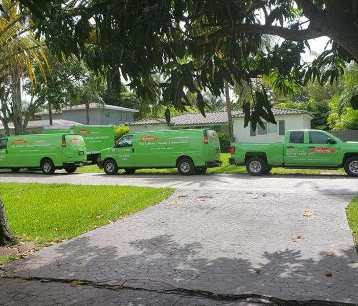 Servpro On The Go - image of green SERVPRO vehicles