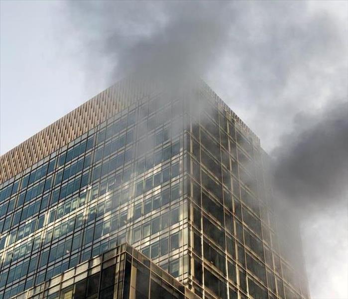 Building with smoke coming out from it.
