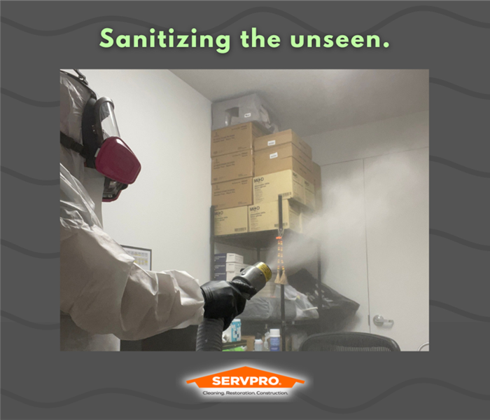 Servpro employee cleaning the area
